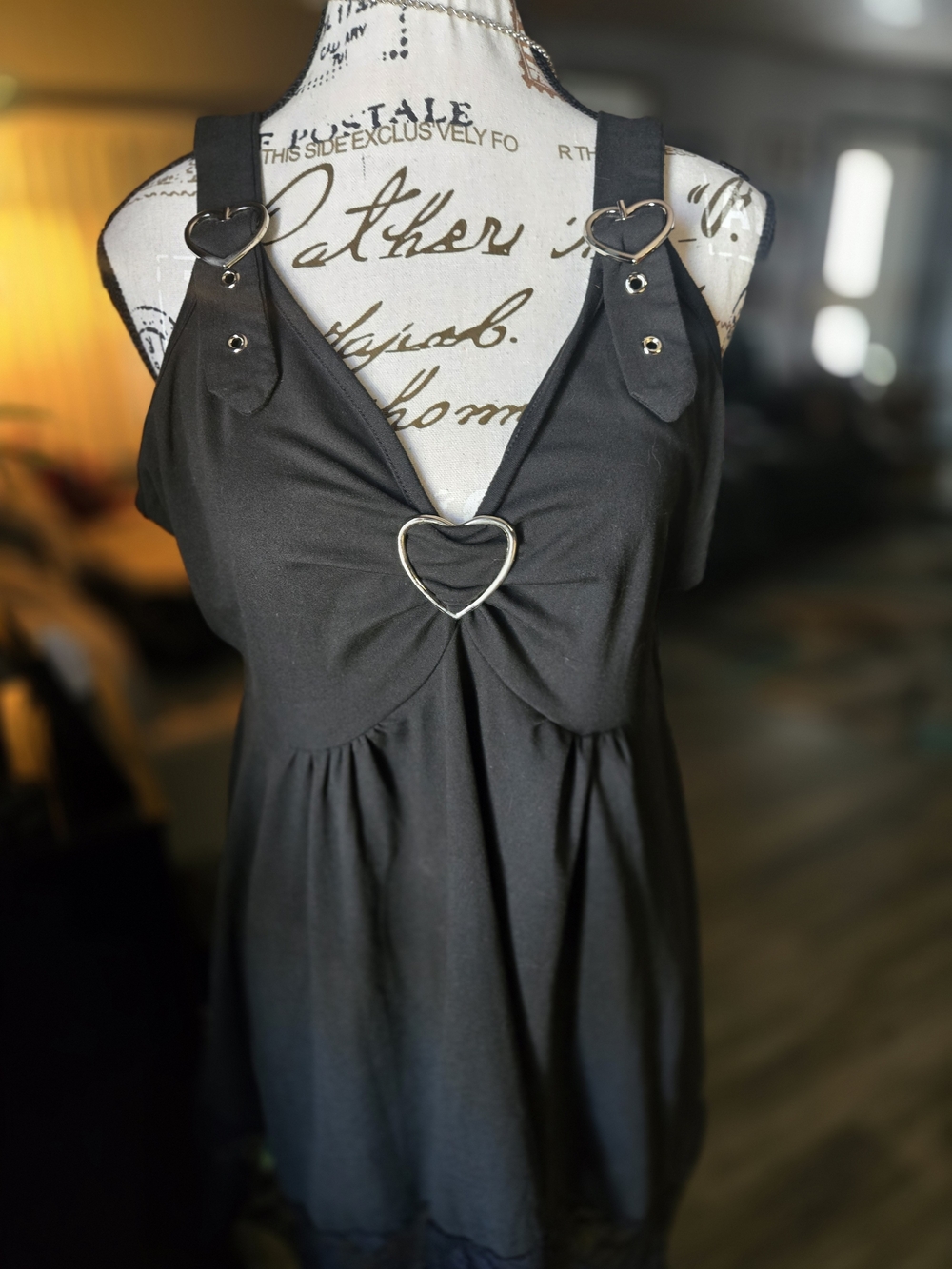 Black Heart-Detail V Neck Top. Handkerchief Hem.